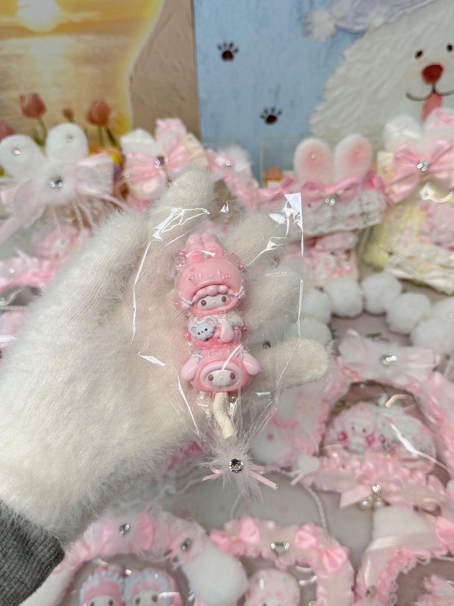 Twin kawaii pink bear mini squeeze toys stacked on a candy stick, featuring whipped cream silicone texture and sprinkle bead details, packaged in a clear bag with fluffy white fur tie and crystal rhinestone